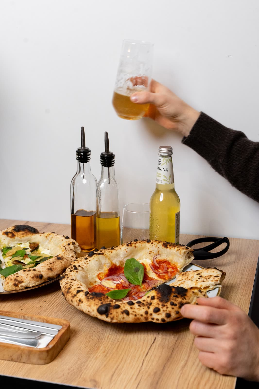 Pizza and drinks on a wooden table