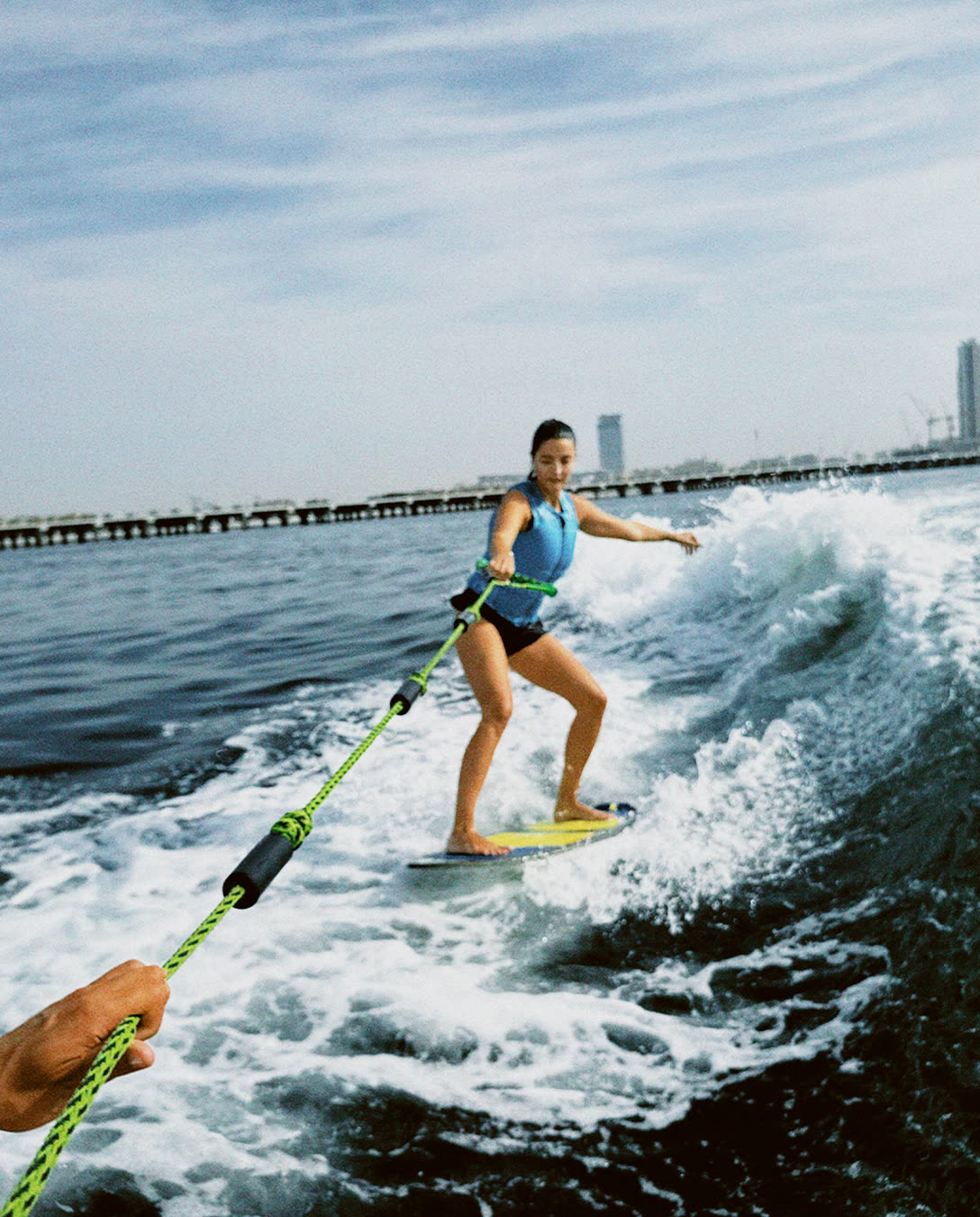 Surfer carving the wake